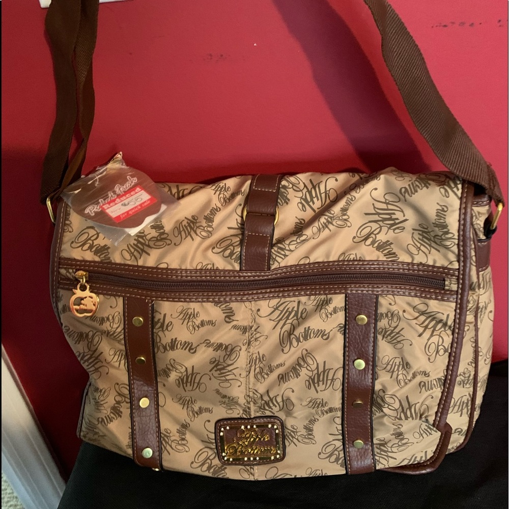 Large designer tan and brown tote style book bag